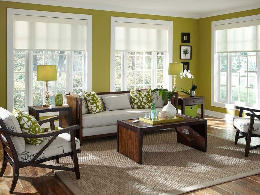A living room with Lutron motorized shades halfway down