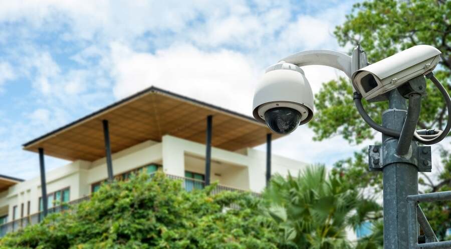A surveillance camera is overseeing a luxury home.