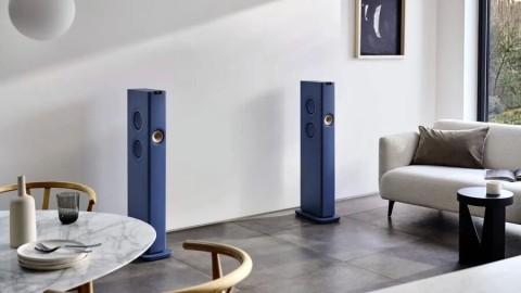 A pair of blue KED LS60 wireless speakers stand out in a white living room. 