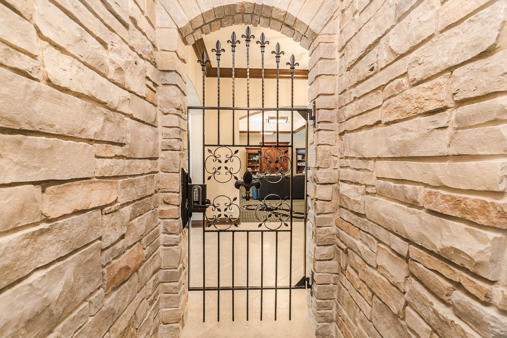 Historic stone entry and iron gate on a North Shore estate