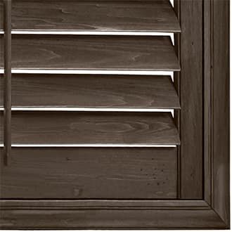 Close-up of dark wood Hunter Douglas shutters.