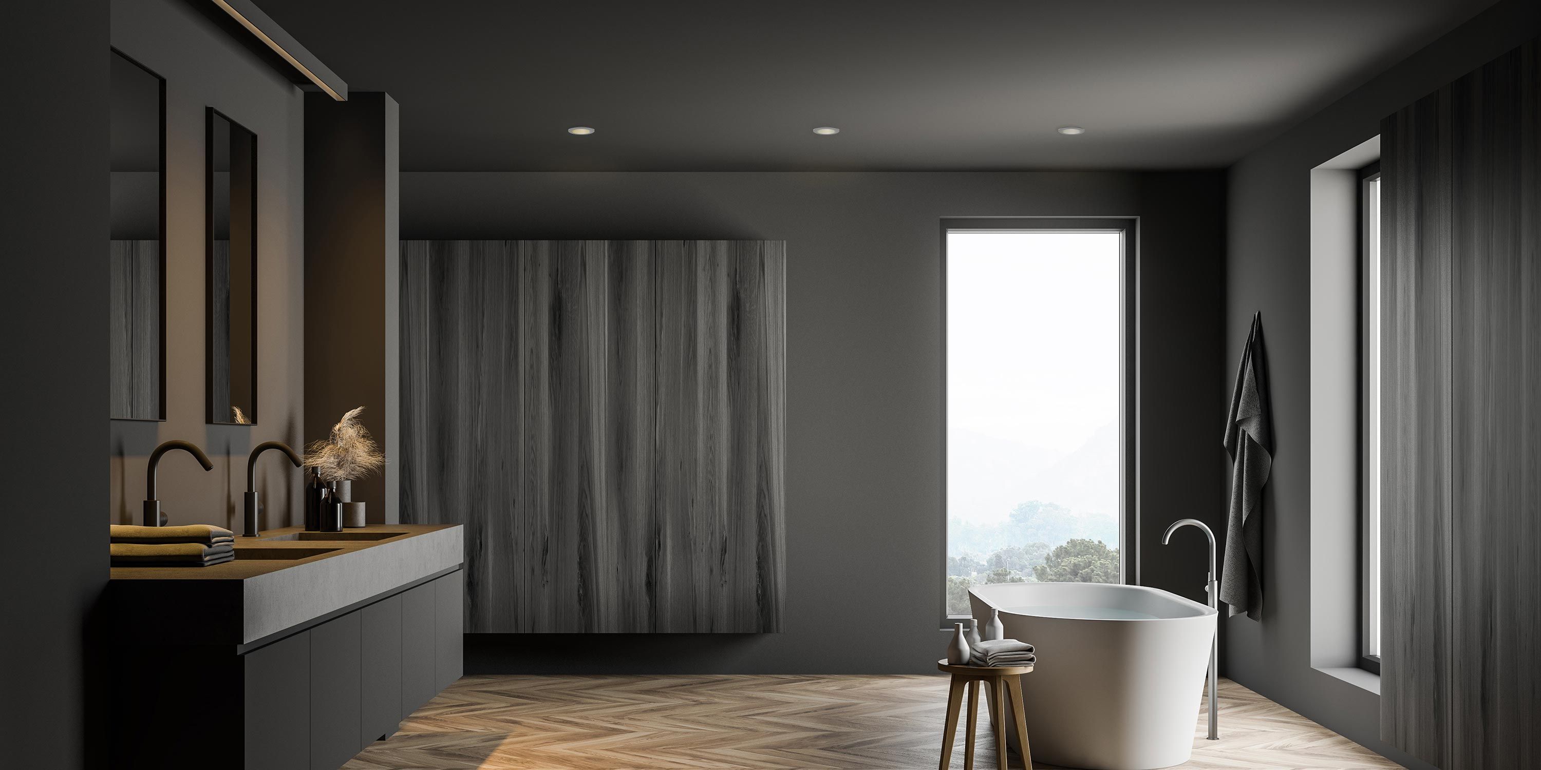 A luxurious bathroom with a standalone tub, wooden cabinets, and natural light.