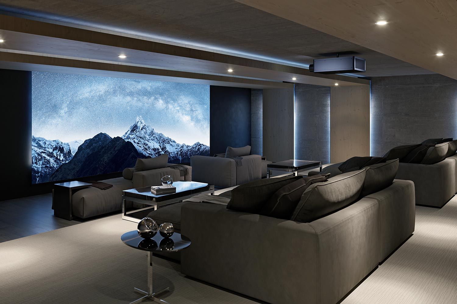 A modern home theater with a cozy blue sectional sofa, wooden ceiling accents, and a large projection screen displaying a scenic beach image.