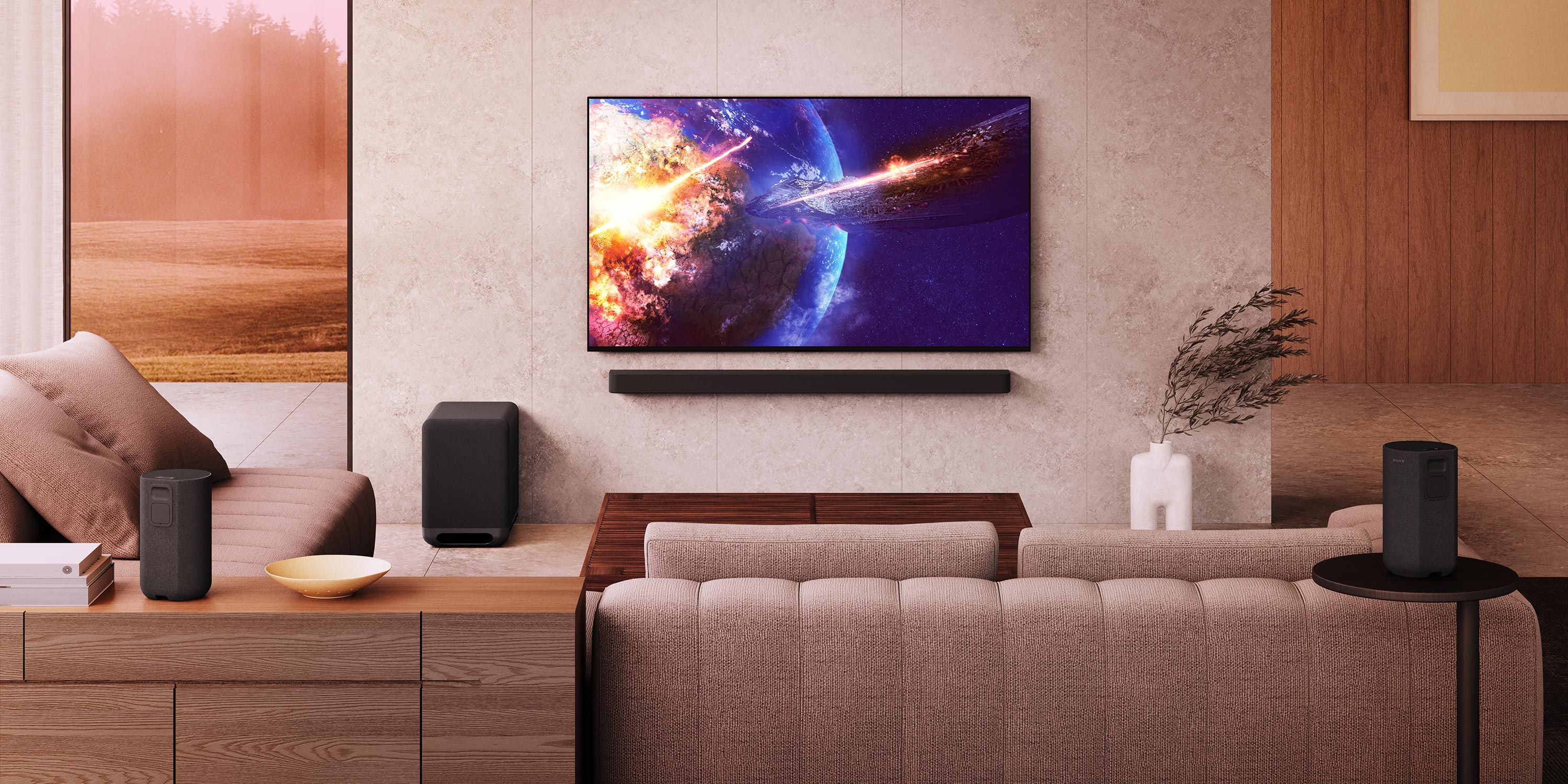 A modern media room with a large wall-mounted TV showing a space scene, surrounded by a comfortable sectional sofa and minimalist decor.