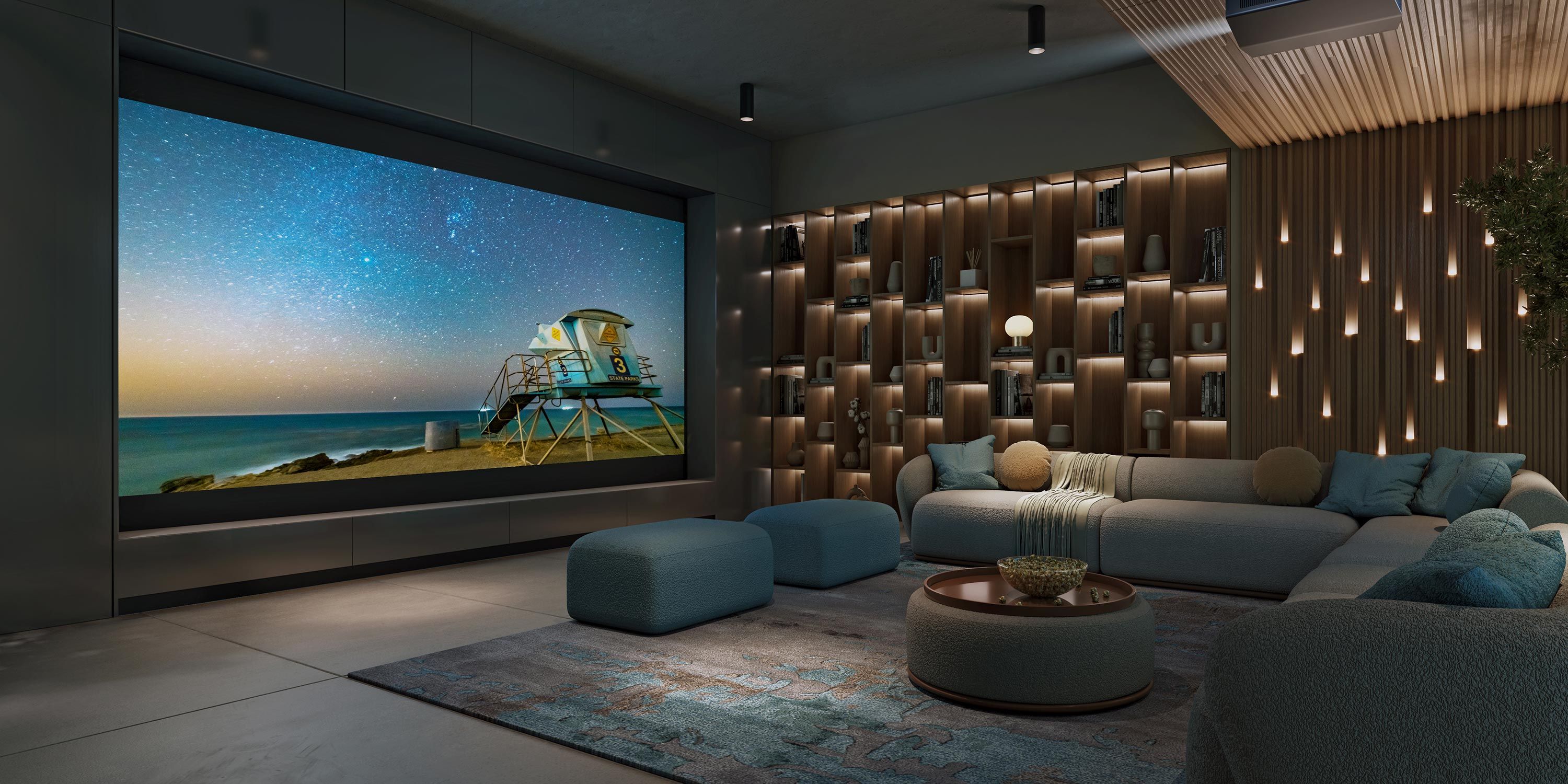 A luxurious home theater with a large screen displaying a beach scene, surrounded by comfortable seating and intricate wall lighting.